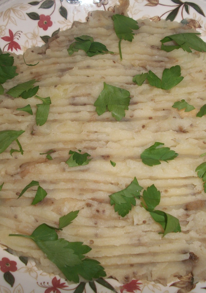 Una foto de Puré de patatas con berenjena al ajo