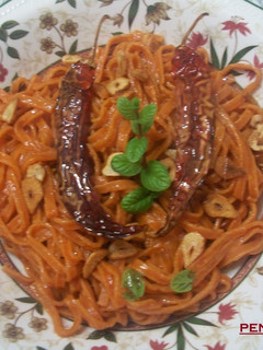 Una foto de Tagliolinis picantes al ajo