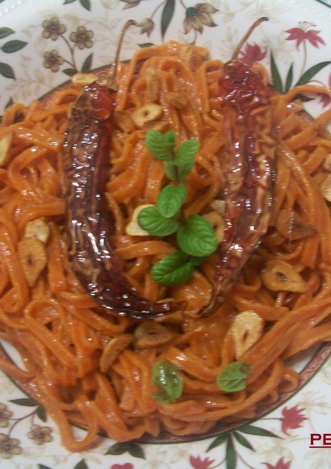 Una foto de Tagliolinis picantes al ajo