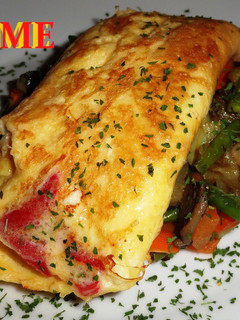 Una foto de Tortilla de queso de cabra y pimiento del piquillo