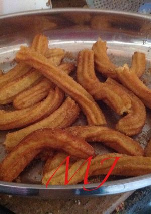 A picture of Orange-Scented Churros.