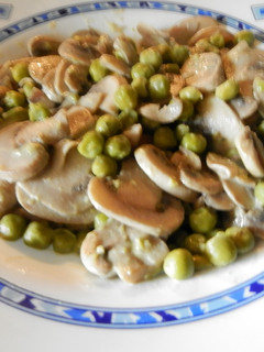 Una foto de Guisantes con champiñones