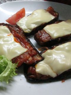 Una foto de Pizzetas de berenjenas con champiñones