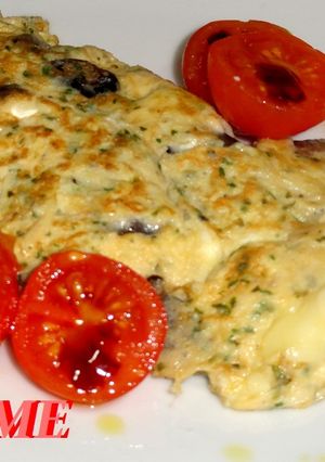 Una foto de Tortilla de champiñones y queso brie
