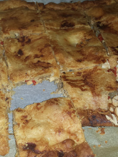 Una foto de Empanada gallega de bonito, cebolla y pimientos