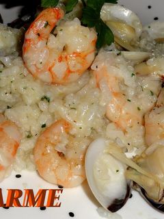 Una foto de Arroz meloso con langostinos y almejas