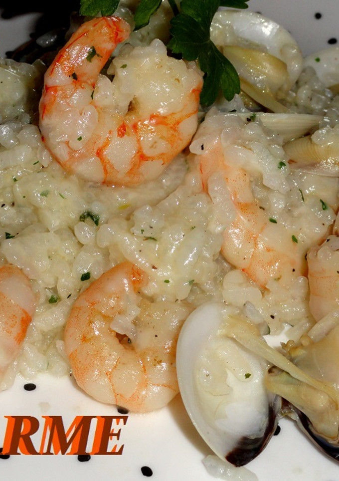 Una foto de Arroz meloso con langostinos y almejas