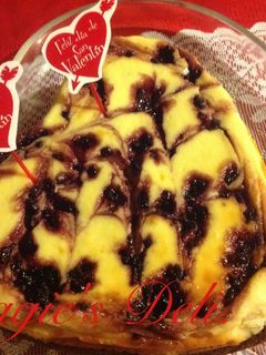 Una foto de Cheesecake brownie y moras