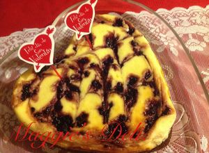 Una foto de Cheesecake brownie y moras