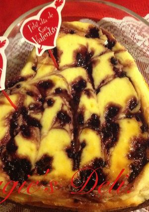 Una foto de Cheesecake brownie y moras