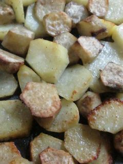 Una foto de Papas y batatas al ajo y pimienta