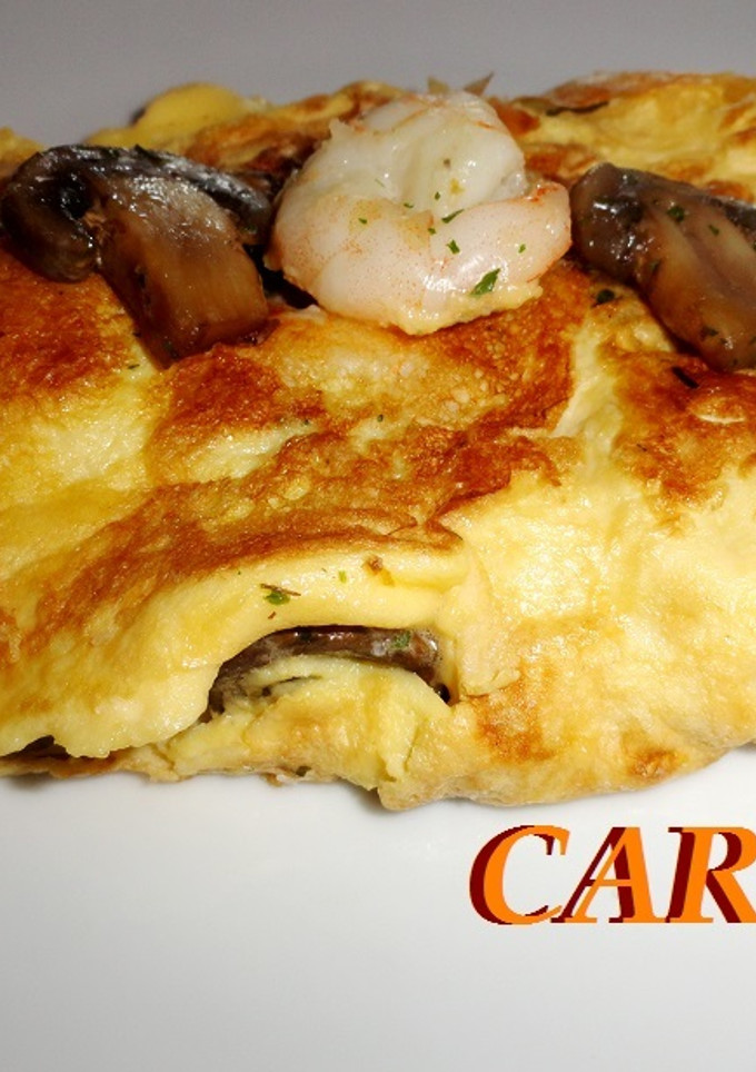 Una foto de Tortilla de langostinos y champiñones