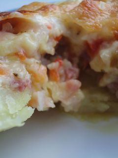 Una foto de Patatas rellenas de verdura y bacón
