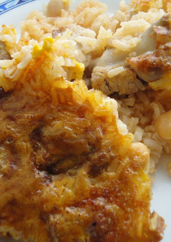 Una foto de Arroz al horno con costra