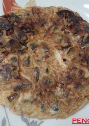 Una foto de Tortilla de asadura de cabrito jugosa