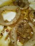 Anillas de calamar encebollado