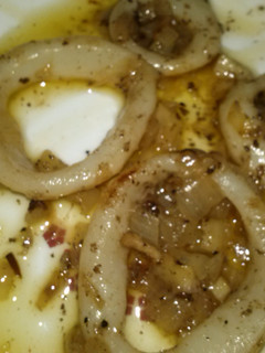 Una foto de Anillas de calamar encebollado
