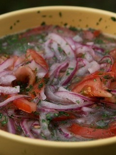 Una foto de Curtido de cebolla y tomate