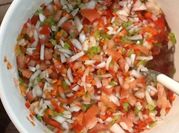 Una foto de salsa criolla
