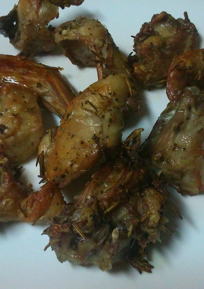 Una foto de Conejo al horno con tomillo y romero