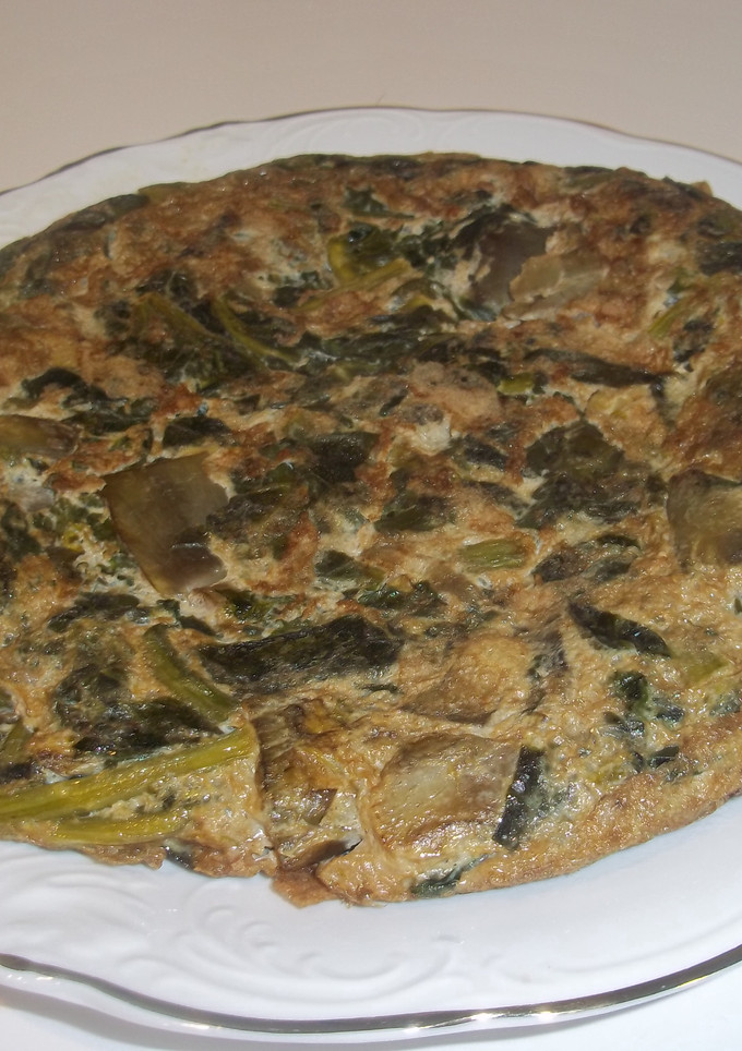 Una foto de Tortilla de espinacas y alcachofas