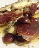 Lubina con jamón ibérico y uva