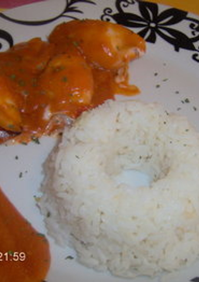 Una foto de Chipirones rellenados de gambas y arroz