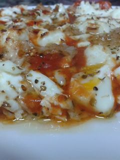 Una foto de Pizza de atún a los dos quesos
