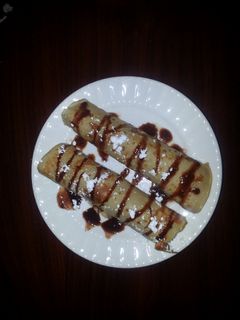 Una foto de Crepas de granola y chocolate