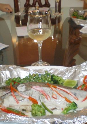 Una foto de Trucha Rellena de queso ahumado y finas Hierbas