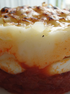 Una foto de Timbal de huevos, patatas y bacon