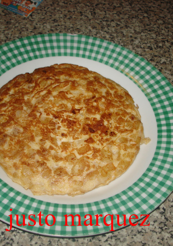 Una foto de Tortilla de patatas con cebolla