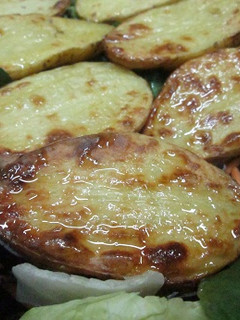 Una foto de Patatas asadas en mitades
