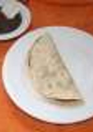 Una foto de Tacos de chicharrón en salsa verde