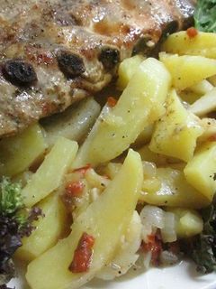 Una foto de Costillar de cerdo al horno con patatas blandas