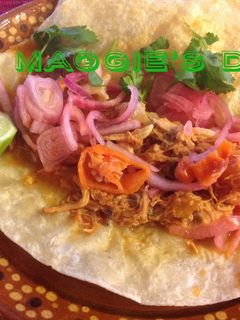Una foto de Pollo en achiote
