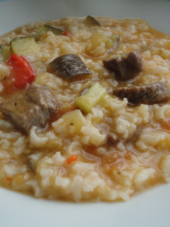 Una foto de Guiso con pisto, morcillo y arroz