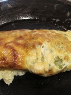Una foto de Tortilla con guisantes y jamón