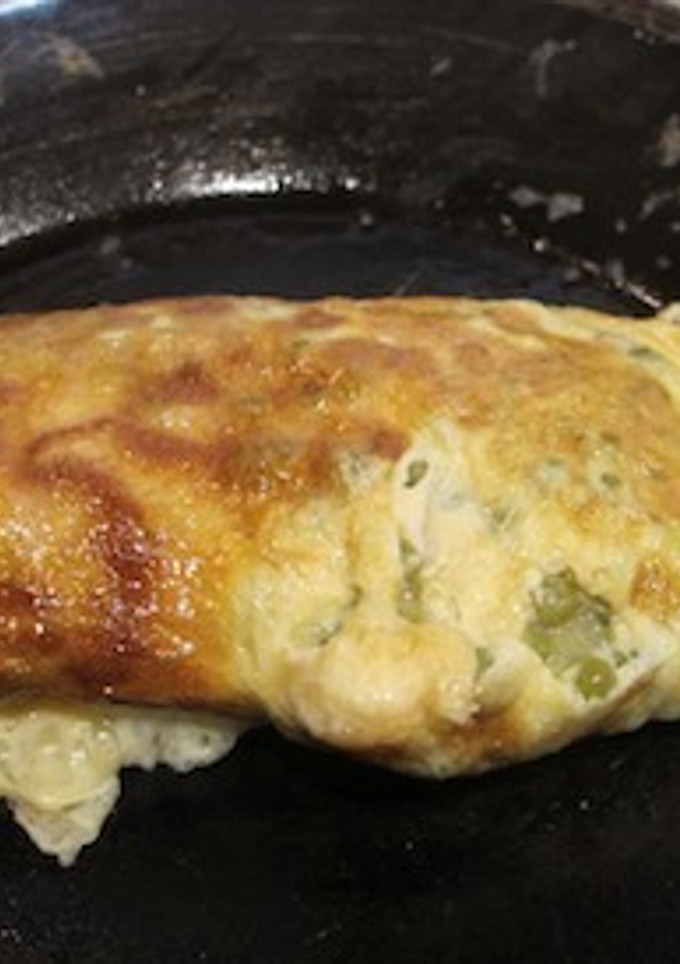 Una foto de Tortilla con guisantes y jamón