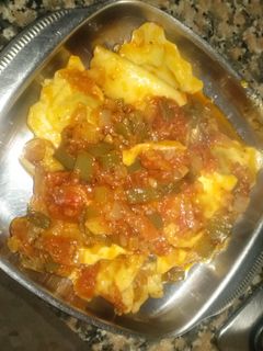 Una foto de Raviolis con sofrito
