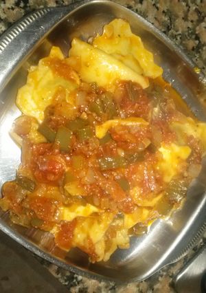 Una foto de Raviolis con sofrito