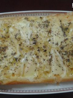 Una foto de Tarta de calabacín con queso provolone al orégano