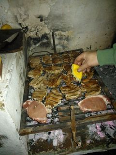 Una foto de Asado a la parrilla de lomo de chancho al pan