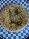 Guiso de arroz con menudos y carcasa de pollo