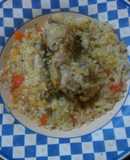 Guiso de arroz con menudos y carcasa de pollo