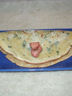 Una foto de Panqueques rellenos de salchichas