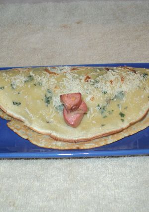 Una foto de Panqueques rellenos de salchichas