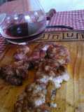 Asado a la parrilla de mollejas de cogote al limón y vino 
