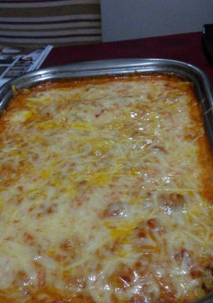 Una foto de Canelones de chancho con salsa rosa