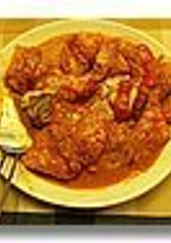 Una foto de Bacalao Encebollado con Salsa de Pimientos al Azafrán